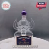 Motörhead Crown Royal glass bottle with a skull-shaped design, horns, and a purple crown bottle cap on a white base.!