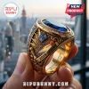 Gold championship ring with blue stone, featuring Knicks basketball court, NYC skyline, and 2025-2026 text on side.!