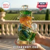 Faceted crystal leprechaun whiskey decanter with green jacket, amber beard, and gold-tone base label against vineyard view.!