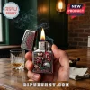 Ohio State Buckeyes branded Zippo lighter with Brutus Buckeye mascot and team logo held in a hand over a wooden table.!