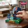 Paris Saint-Germain building block set featuring a soccer player, trophy, and PSG logo on a green field base.!