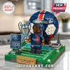 Paris Saint-Germain building block set featuring a soccer player, trophy, ball, and miniature Eiffel Tower on green base.!