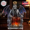 Ozzy Osbourne shaped silver decanter with bat wings, skull armrests, gold crown stopper, and amber liquid interior.!