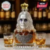 Ozzy Osbourne shaped glass decanter with a gold crown, bat emblem, and text reading Eternal Lord of Rock 1948-2025.!