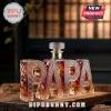 Custom PAPA letter-shaped glass whiskey decanter with intricate Celtic thistle engravings on a wooden surface.!