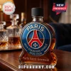 Paris Saint-Germain glass whiskey bottle featuring a circular UEFA Champions League 2025/2026 emblem in blue, red, and gold.!