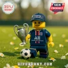 Lego-style minifigure wearing a Paris Saint Germain jersey and cap holding a silver Champions League style trophy.!