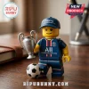 Paris Saint-Germain minifigure wearing a team cap and jersey holding a miniature silver Champions League trophy.!