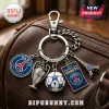 Paris Saint-Germain metal keychain with five charms: team logo, trophy, soccer ball, winners plaque, and Eiffel Tower.!