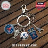 Paris Saint-Germain keychain with charms including club logo, Champions League trophy, soccer ball, and Eiffel Tower.!