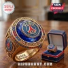 Gold championship ring with Paris Saint-Germain FC crest, blue center stone, and 2026 UEFA Champions League text engraving.!