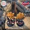 Two vinyl cheetah mascots in PSG jerseys holding silver trophies on circular branded stands overlooking the Eiffel Tower.!
