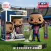 Vinyl figure of a soccer player holding a trophy, standing on a grass base next to its branded display box.!