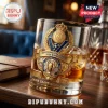 Paris Saint-Germain themed glass featuring a golden UEFA Champions League 2026 winners emblem and crown on a wood table.!