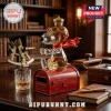 Glass Snoopy pilot figurine wearing a golden crown and goggles, filled with amber liquid, sitting on a red metal mailbox.!