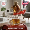 Snoopy character glass whiskey decanter wearing a golden crown and aviator goggles with a flowing red scarf.!