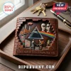 Brown leather bi-fold wallet featuring embossed Pink Floyd iconography, including a prism, Battersea power station, and masks.!