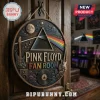 Circular wooden Pink Floyd Fan Room sign with prism, guitars, and vinyl record artwork hanging on a dark wood door.!