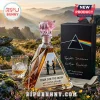 Pink Floyd Dark Side of the Moon 60th anniversary glass rum bottle with pink pig stopper and prism box on wooden table.!