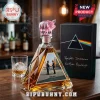 Pink Floyd prism decanter with a pink pig stopper, featuring Wish You Were Here artwork on a triangular glass bottle.!