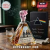 Pink Floyd Dark Side of the Moon rum bottle with a pink glass pig stopper and triangular crystal glass vessel.!