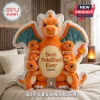 Charizard plush holding four small Charmander dolls with custom embroidered names on a white shaped pillow backdrop.!