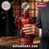 Red devil glass decanter shaped like a mascot holding a trident with a soccer ball stopper and Red Devil label text.!