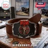 Rush band belt buckle featuring a metallic Starman logo, red accents, and text reading 2112: The Temples of Syrinx.!