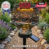 Rush band solar garden light featuring miniature figures on a rock base with a 58th anniversary plaque and LED stage lights.!