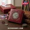 Maroon bi-fold wallet featuring a metallic Rush logo and engraved signatures of Geddy Lee, Alex Lifeson, and Neil Peart.!