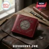 Maroon leather bifold wallet with silver drum-style Rush band logo, embossed signatures, and EST. 1968 text on brown leather.!