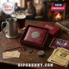 Rush band memorabilia set featuring a burgundy leather wallet, metallic coaster, guitar pick, and keychains on a desk.!