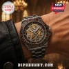 Rush Clockwork Angels men's wristwatch with gold star gear dial, red ruby accents, and metal bracelet on a wrist.!
