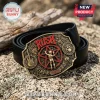 Rush band belt buckle featuring a starman logo, guitar, and drum kit icons on an antique brass finish with a black leather belt.!
