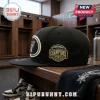 Black snapback hat with San Antonio Spurs team logo and gold embroidered Conference Champions patch on wood bench.!