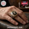 San Antonio Spurs championship-style ring with black stone, gold logo, and silver accents on a man's finger.!