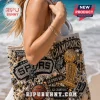 Beaded San Antonio Spurs tote bag with rhinestones, basketball trophy, and team logos on a beach background.!