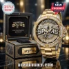 Gold San Antonio Spurs watch with diamond-encrusted bezel and black display box featuring team logo and gold lettering.!