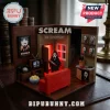 Scream 30th anniversary brick diorama featuring a Ghostface minifigure, red sofa, movie poster, and lit doorway.!