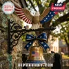 Patriotic brass bell wall hanging with an American eagle topper, blue bow, and 1776-2026 anniversary engraving.!