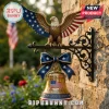Wall-mounted American eagle brass bell with 1776-2026 250th anniversary text and patriotic bow on a stone wall exterior.!