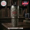 Slayer metal band stainless steel tumbler with eagle logo, pentagrams, and Reign in Blood text on a dark wood background.!