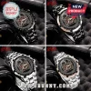 Slayer band themed wristwatch with eagle emblem, tachymeter bezel, and stainless steel link band on black foam background.!