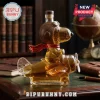 Snoopy Flying Ace shaped glass whiskey decanter filled with amber liquid, set on a dark wood desk with a vintage globe.!