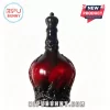 Deep red glass whiskey decanter with an ornate black decorative crown stopper and relief pattern against white background.!