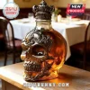 Skull-shaped glass whiskey decanter with ornate silver filigree metal casing and a matching ornate crown-style stopper.!