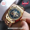 Gold-tone Star Trek 60th Anniversary wristwatch with blue face, star insignia, and metallic link band on a wrist.!