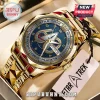 Gold-tone Star Trek 60th anniversary wrist watch with a blue dial, metallic Federation insignia, and linked metal strap.!