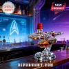 U.S.S. Enterprise NCC-1701 shaped glass whiskey decanter with red wax seal on a wooden bar counter.!