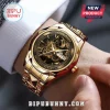 Gold Star Wars 50th anniversary analog wristwatch featuring a Darth Vader dial graphic, metal band, and day-date display.!